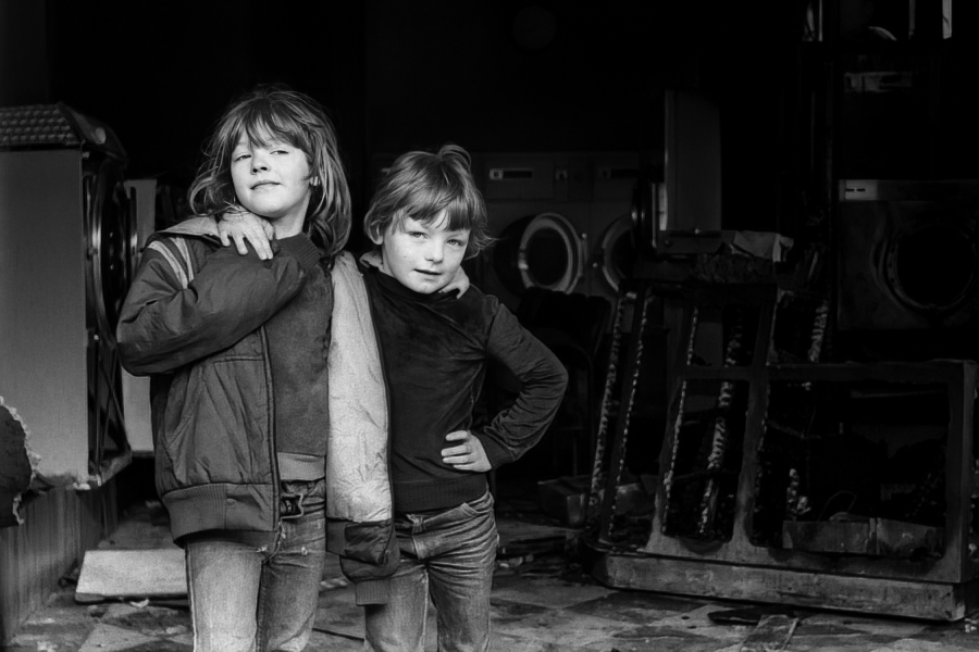 Children playing in arsoned laundry, off Montague Street, Blackburn 1984