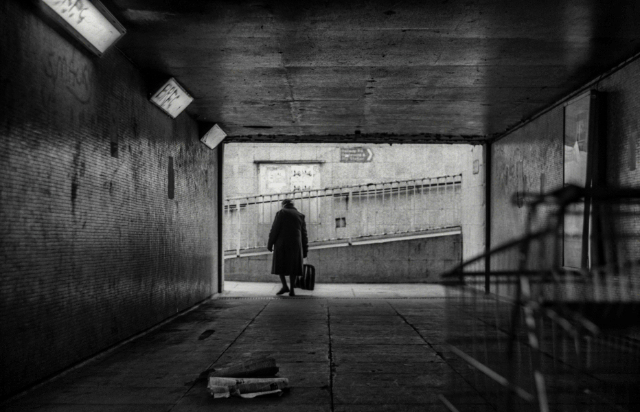 Old woman using subway, litter and trolly, near Boulevard, Blackburn