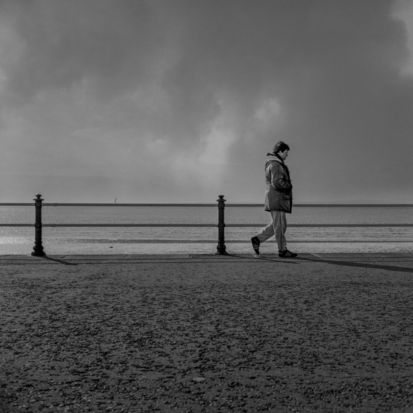 Man walking on Northern Promenade, Blackpool 1987 - British Coastal Resorts a Photographic Essay by Christopher John Ball