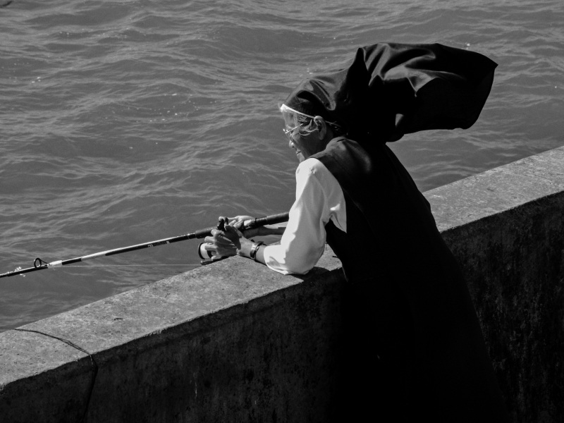 Nun fishing near Pier, Brighton 2005 From British Coastal Resorts - Photographic Essay by Christopher John Ball