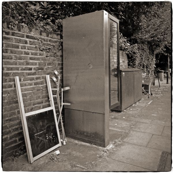 Crutches and Chalkboard left next to Telephone Box - Discarded: Photographic Essay by Christopher John Ball - Photographer & Writer