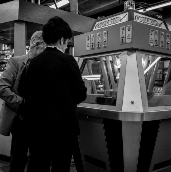 Gambling on slots on Pier, Morecambe, 1988 From British Coastal Resorts - Photographic Essay by Christopher John Ball